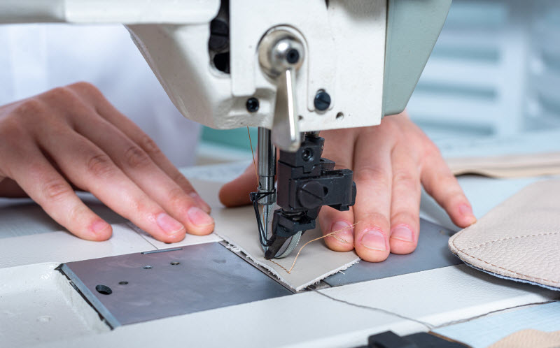 woman using a sewing machine